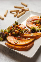 sliced baked pumpkin, with broccoli and assorted vegetables