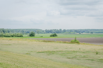 Fototapeta na wymiar Plowed in winter field (arable land)