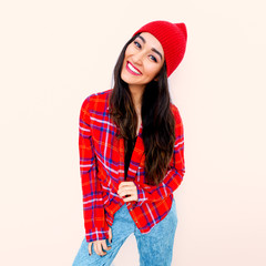 Happy brunette Model Fashion Checkered shirt and beanie cap. Casual Jeans. Trends outfit