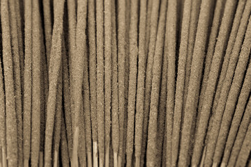 Background incense sticks. Incense used in religious ritual very popular in Vietnam. It is burned to intend as a sacrificial offering to various deity or to serve as an aid in prayer. Black and White © trongnguyen