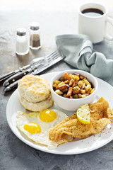 Fried fish breakfast with sunny side up eggs