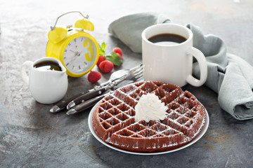Red velvet waffles with whipped cream