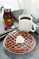 Red velvet waffles with whipped cream
