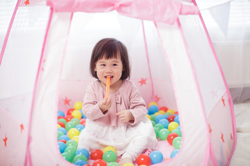 baby girl play tent and ocean ball at home