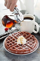 Red velvet waffles with whipped cream