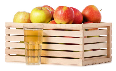 A wodden box of apples a glass of apple juice