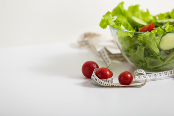 proper nutrition, fitness food, vegetable salad, tomato, diet program. concept of healthy food on a white background for advertising your text