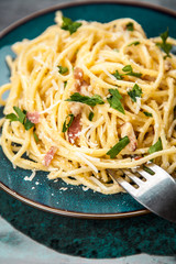 Spaghetti carbonara with egg and pancetta