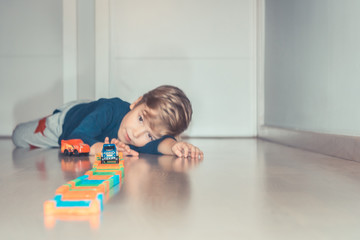 Small boy enjoying in playtime at home.