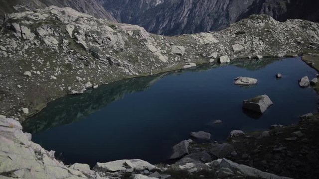 Glacial Corrie In Mountain Range With Mountain Lake