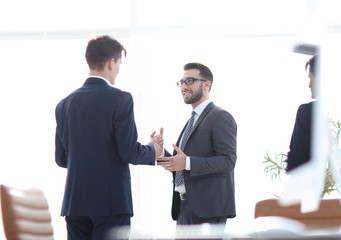 employees of the company standing in the office