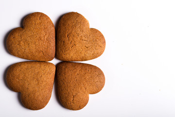  Biscuits in the form of hearts, on white background. Close-up.