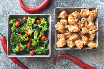 Bowls of broccoli and chicken stir-fry