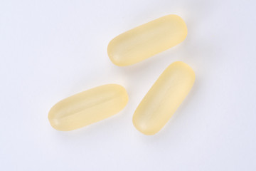 yellow white pills capsule isolated on white background