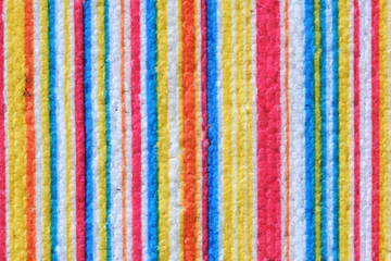 Striped beach towel useful as a background pattern