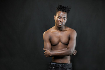 Fototapeta na wymiar emotions black young man on a black background