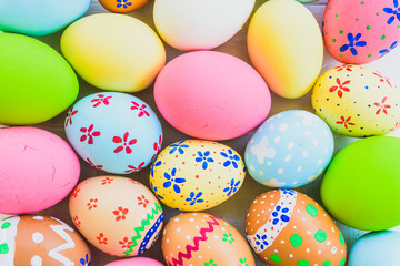 Fototapeta na wymiar Happy easter! Closeup Colorful Easter eggs background. Happy family preparing for Easter.