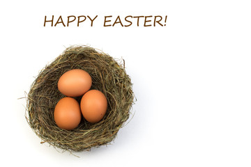 Happy Easter. Top view nest with three whole brown eggs isolated on white background. Copy space for text.