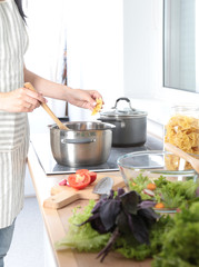 Fresh vegetables on the cutting board, salad in a glass dish. Concept of cooking