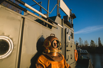a brave diver stands on the deck of a ship