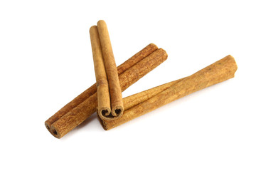 Top view of cinnamon sticks isolated on white.