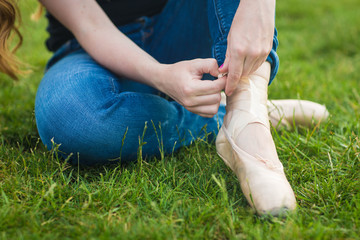 Woman Tying Ballet Slipper © Jenna Hidinger Photo