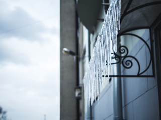 Naklejka premium close up of frozen icicles on the porch outside
