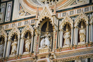 Fototapeta na wymiar Details on the facade of the Cathedral Santa Maria del Fiore, The Dome in Florence, Tuscany, Italy