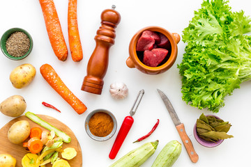 cut vegetables for cooking ragout or ratatouille for healthy dinner white background top view
