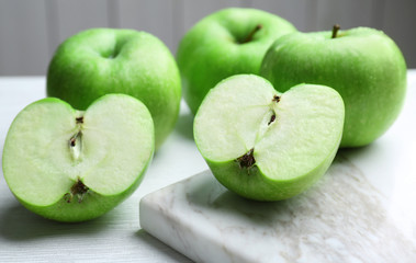 Fresh green apples on light table