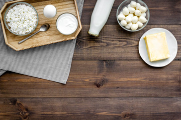 Dairy products from farm. Milk, cottage, cheese, yougurt on wooden top view mockup