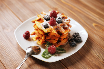 Belgian waffles with blueberries, raspberries  and powdered suga