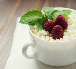 Time for breakfast. Cottage cheese with raspberries