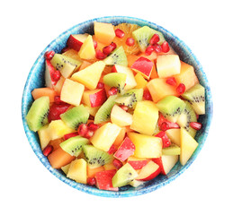 Bowl with fresh cut fruits on white background