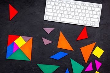 pieces of bright paper for puzzle on dark office background top view mockup