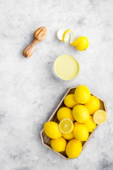 yellow citrus fruit set with lemons stone background top view mock-up