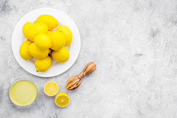 yellow citrus fruit set with lemons stone background top view mock-up