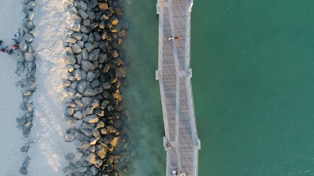 Aerial view of people walking on a pier 