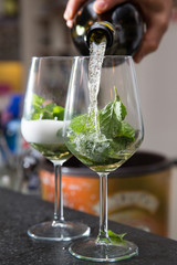 preparing mint and wine cocktails