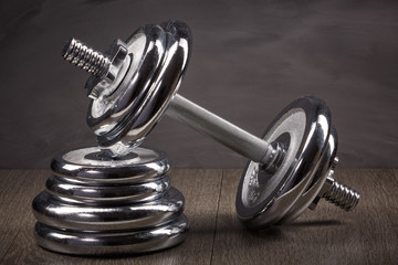 Obraz na płótnie Canvas Steel dumbbell and weights.