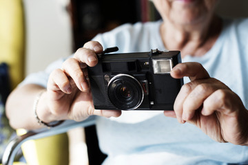 Senior woman taking a picture