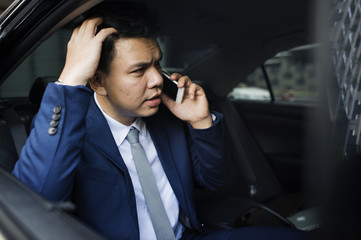 Businessman sitting in the car