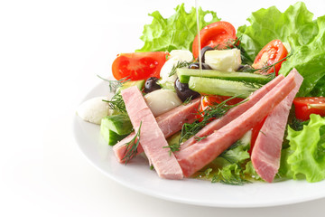 Fresh vegetable salad in a plate. Restaurant serving. Isolated.