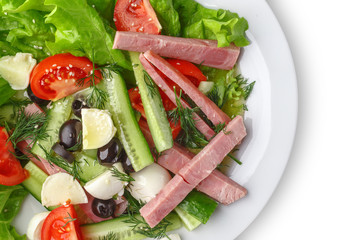 Fresh vegetable salad in a plate. Restaurant serving. Isolated.