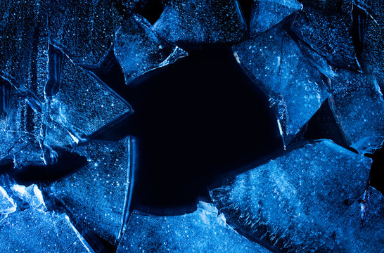 Photo texture of a broken blue lightened and toned ice with copyspace.