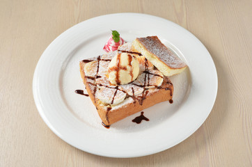 Honey toast with  ice cream,banana and marshmallows.