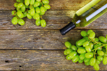 White wine and grapes Wine and grapes in vintage setting with wooden table