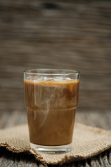 Classic still life a glass of coffee with copy space, vertical vintage picture.