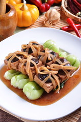 Chinese vegetarian food. fried tofu with mushroom and Chinese mustard 