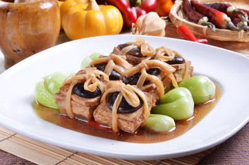 Chinese vegetarian food. fried tofu with mushroom and Chinese mustard 